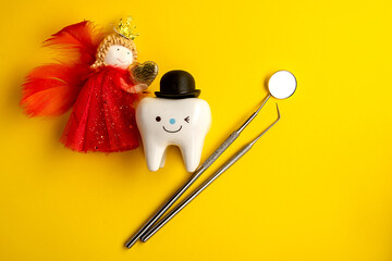 tooth fairy and tooth figurine and dental tools