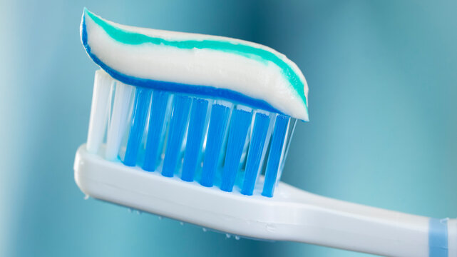 Toothbrush and toothpaste close up view