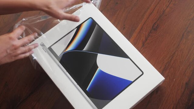Person unboxing new laptop. Unboxing and Review.