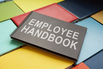An employee handbook on the colorful books. - obrazy, fototapety, plakaty