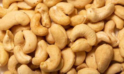 Cashew nuts as a background, top view. Cashew isolated on white background. Healthy foods.