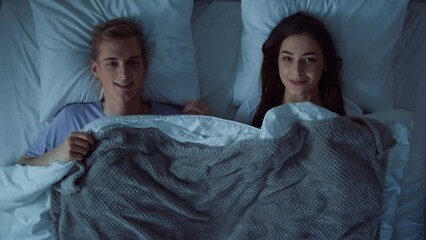 Couple Going to Sleep at Night. Couple Lying in Bed. Lovely Couple Looking at Eact Other in Bed. Bed Time. Up Down View Shot on RED