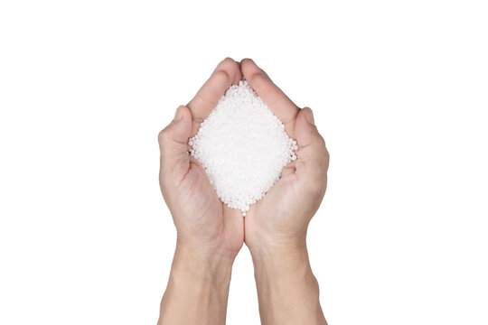 Chemical fertilizers in hand isolated on white. Nitrogen