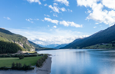 Obraz premium drone flight over Lake Reschensee in South Tyrol