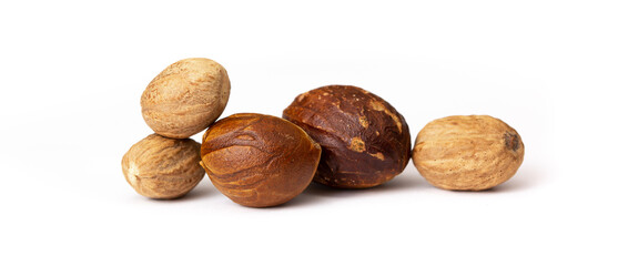 Nutmeg close-up on a white background. Indian spices close up. Medicinal herbs and spices.