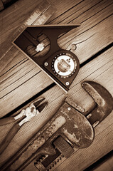 Sepia Image of Old Vintage Tools on Weathered Wood