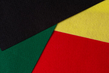 Black History Month color background with copy space for text. Geometric felt textile background in black, red, yellow, green colors