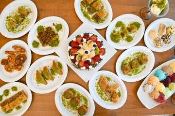 Delicious meat kebab with fresh vegetable salad served with variety of Turkish dishes and appetizers. Top view of assorted Turkish food and meze, tasty and healthy Mediterranean cuisine.