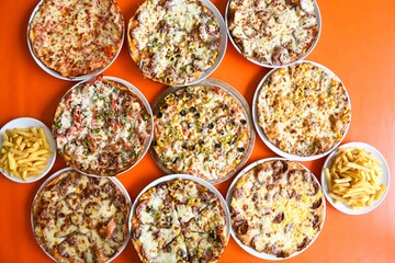 Delicious meat kebab with fresh vegetable salad served with variety of Turkish dishes and appetizers. Top view of assorted Turkish food and meze, tasty and healthy Mediterranean cuisine.