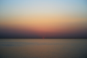Pastel coloured sunrise over the sea