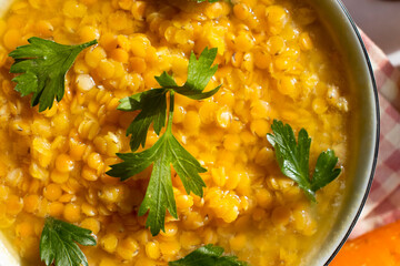 Lentil soup on a wooden background