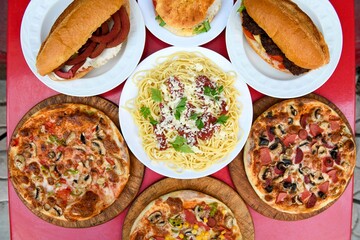 Table scene of assorted take out or delivery foods. Traditional Turkish cuisine. Various Turkish meal and appetizers. Top down view on a table.