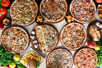 Delicious mixed pizza with rich content. Menu concept of choice and diversity. Sucuklu, Mantarli, karisik, akdeniz pizza