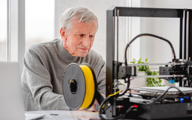 Fototapeta na wymiar Man with 3D printer