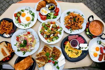 Table scene of assorted take out or delivery foods. Traditional Turkish cuisine. Various Turkish meal and appetizers. Top down view on a table.