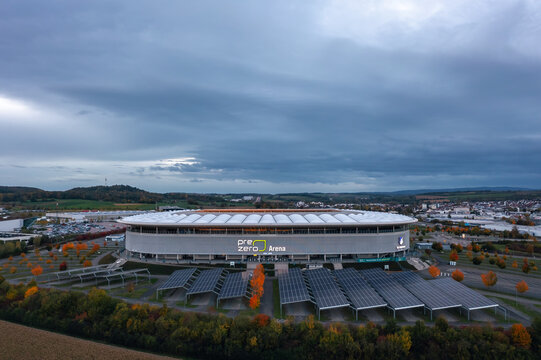 Aerial night view of Rhein-Neckar-Arena (PreZero Arena), home stadium for Bundesliga football club TSG 1899 Hoffenheim. Sinsheim, Germany - October 2021