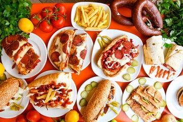 Delicious meat kebab with fresh vegetable salad served with variety of Turkish dishes and appetizers. Top view of assorted Turkish food and meze, tasty and healthy Mediterranean cuisine.