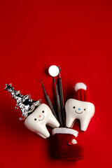 Tooth figurines and dental tool for christmas and new year 2023, top view. holiday medical concept