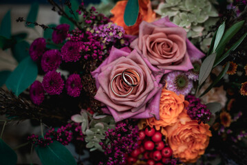 Two wedding rings on flower bouquet