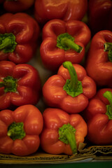 Red pepper on market. Juicy pepper top view. Vegetables in drawer. Healthy food.