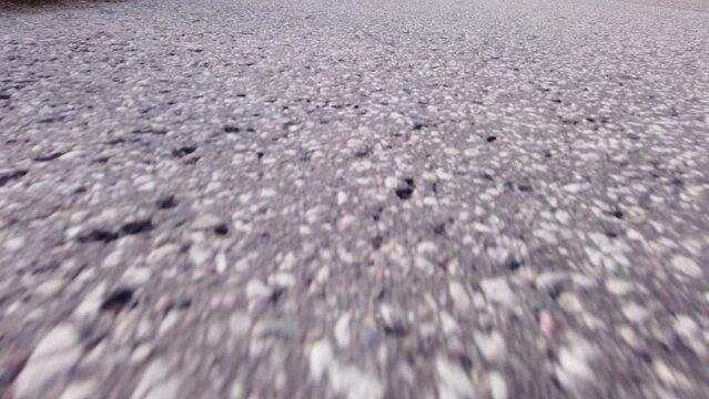 Asphalt motion with glitches abstract background. moving on the road with shines and shadows close up