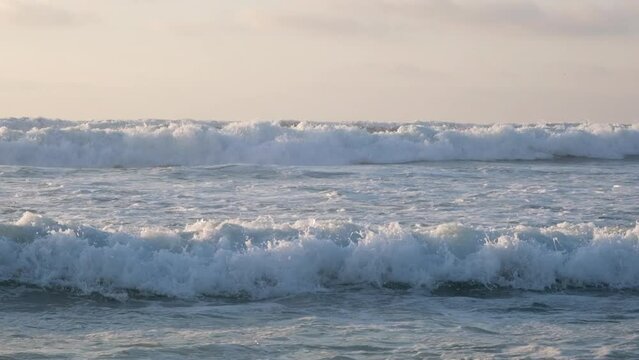 Close up view on high waves on the empty coast of the Atlantic Ocean. Slow motion Full HD video of empty beautiful evening ocean beach