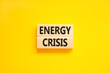 Global energy crisis symbol. Concept words Energy crisis on wooden blocks. Beautiful yellow table yellow background. Business global energy crisis concept. Copy space.