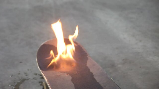 Skateboard Lit on Fire