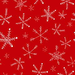 Seamless Christmas pattern with white snowflakes on a red background