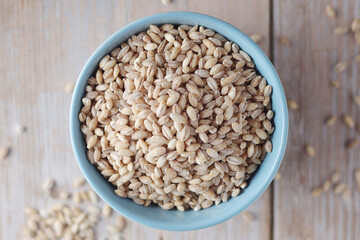 A bowl with raw barley seeds	