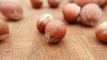 Huzelnut on wooden table. Close up nut with depht of field.