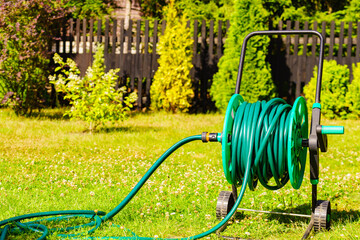 Garden hose for watering plants in garden