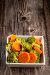 Bowl with broccoli and carrot salad.