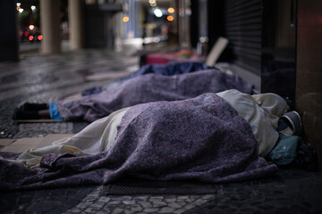 homeless people sleeping in the streets of rio de janeiro, brazil.
