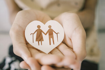 Teen hands holding elderly couple with walking sticks in heart shape, older people mental health,...