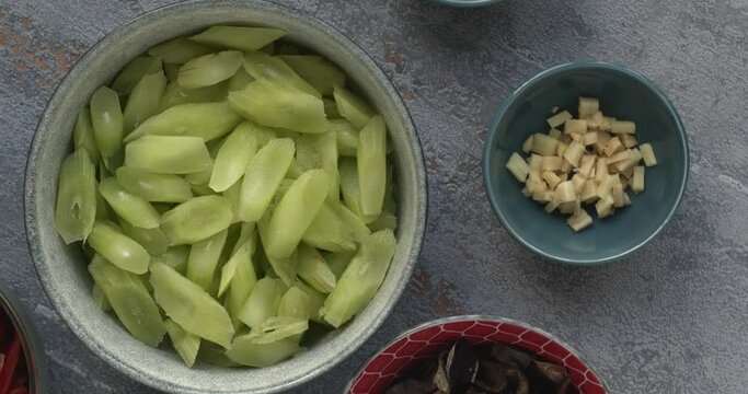 Celtuce (steam lettuce) with wood ear mushrooms (mun)  - Chinese cuisine. Ingredients prepared for wok stir fry.