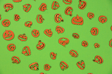Halloween carved in wood Pumpkins pattern on green screen background.
