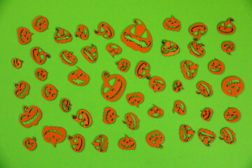 Halloween carved in wood Pumpkins pattern on green screen background.