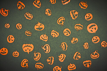 Halloween carved in wood Pumpkins pattern on colored background.