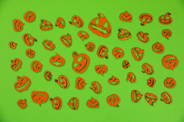 Halloween carved in wood Pumpkins pattern on green screen background.