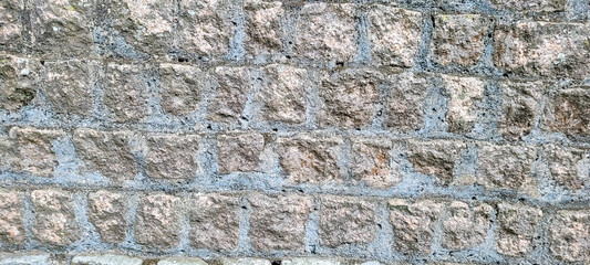 old brick wall of dark stones