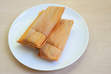 Three Tamales on a plate