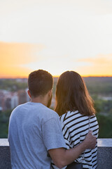 Couple watching Madrid View at sunset from Mirador de la Cornisa del Palacio Real