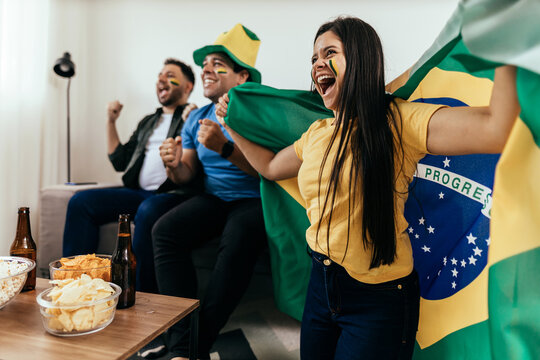 Football Fans Friends Watching Brazil National Team In Live Soccer Match On TV At Home