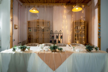 Decorated table for newlyweds with flowers