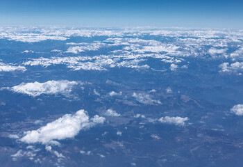 Panoramic snowy high mountains . Winter aerial view of mountains . Flight over the ridge 
