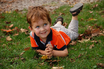 Portrait of the little boy on the grass