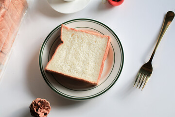 Slice Bread with hot coffee and marshmallow on white background.  Morning breakfast with coffee, butter and toasts.