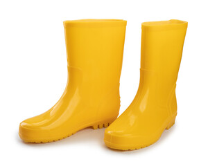 pair of waterproof yellow rubber boots for workers isolated on white background