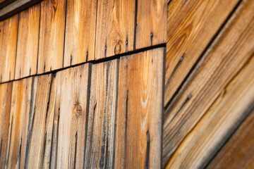 Beautiful fresh larch wooden texture background on boards with door on wooden wall	